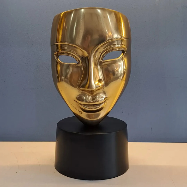 Golden Face Statue on Round Black Base