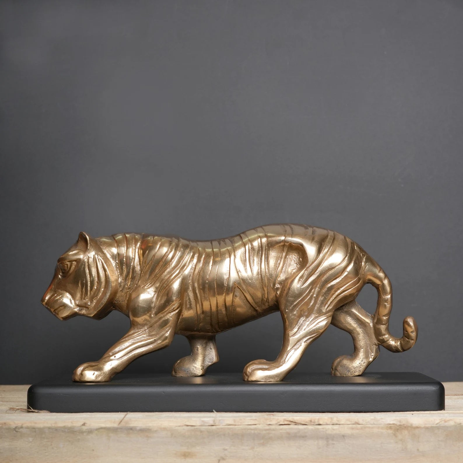Majestic Tiger Sculpture on Black Wooden Base