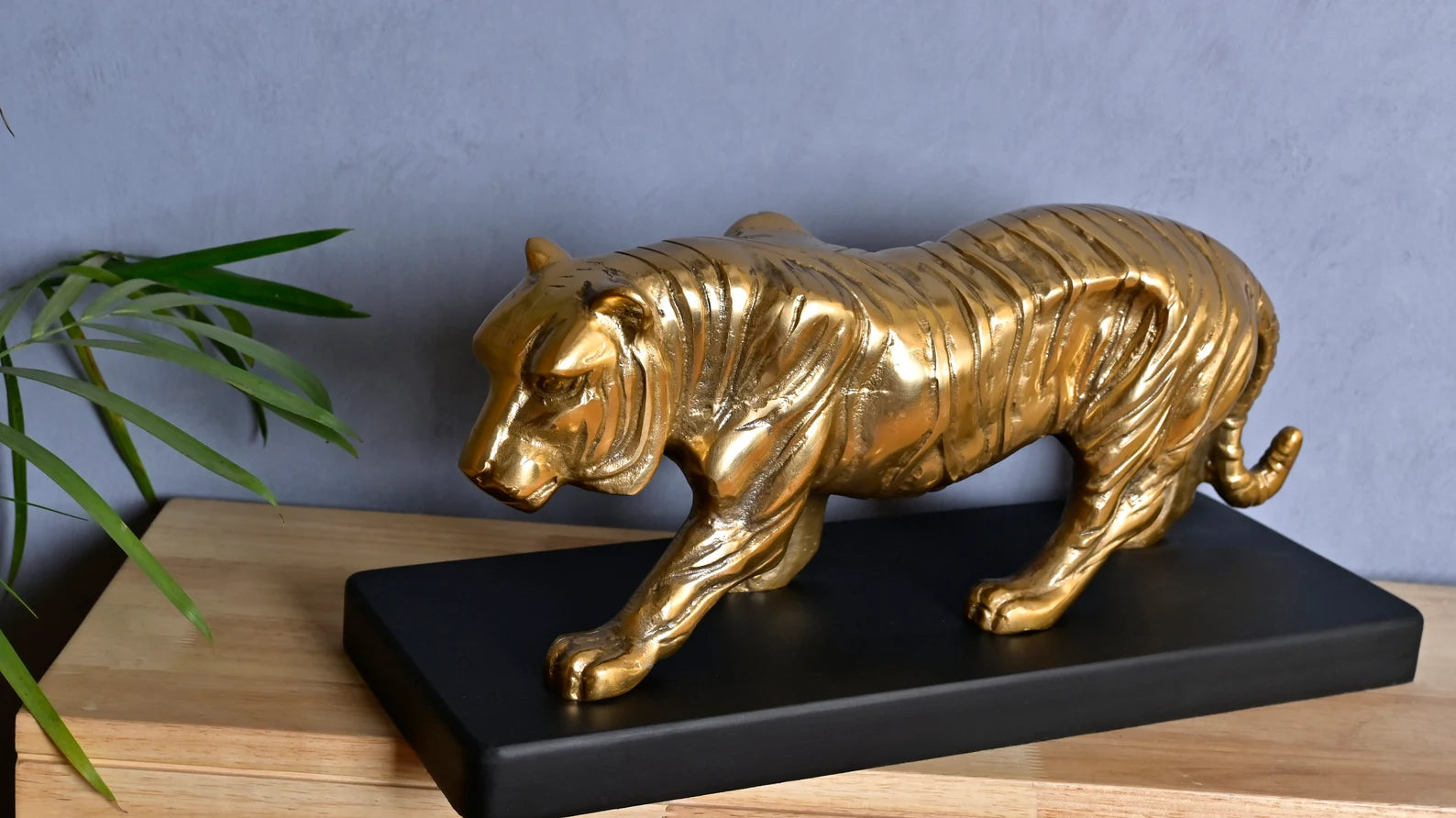 Majestic Tiger Sculpture on Black Wooden Base