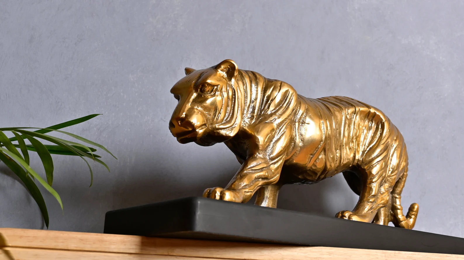 Majestic Tiger Sculpture on Black Wooden Base