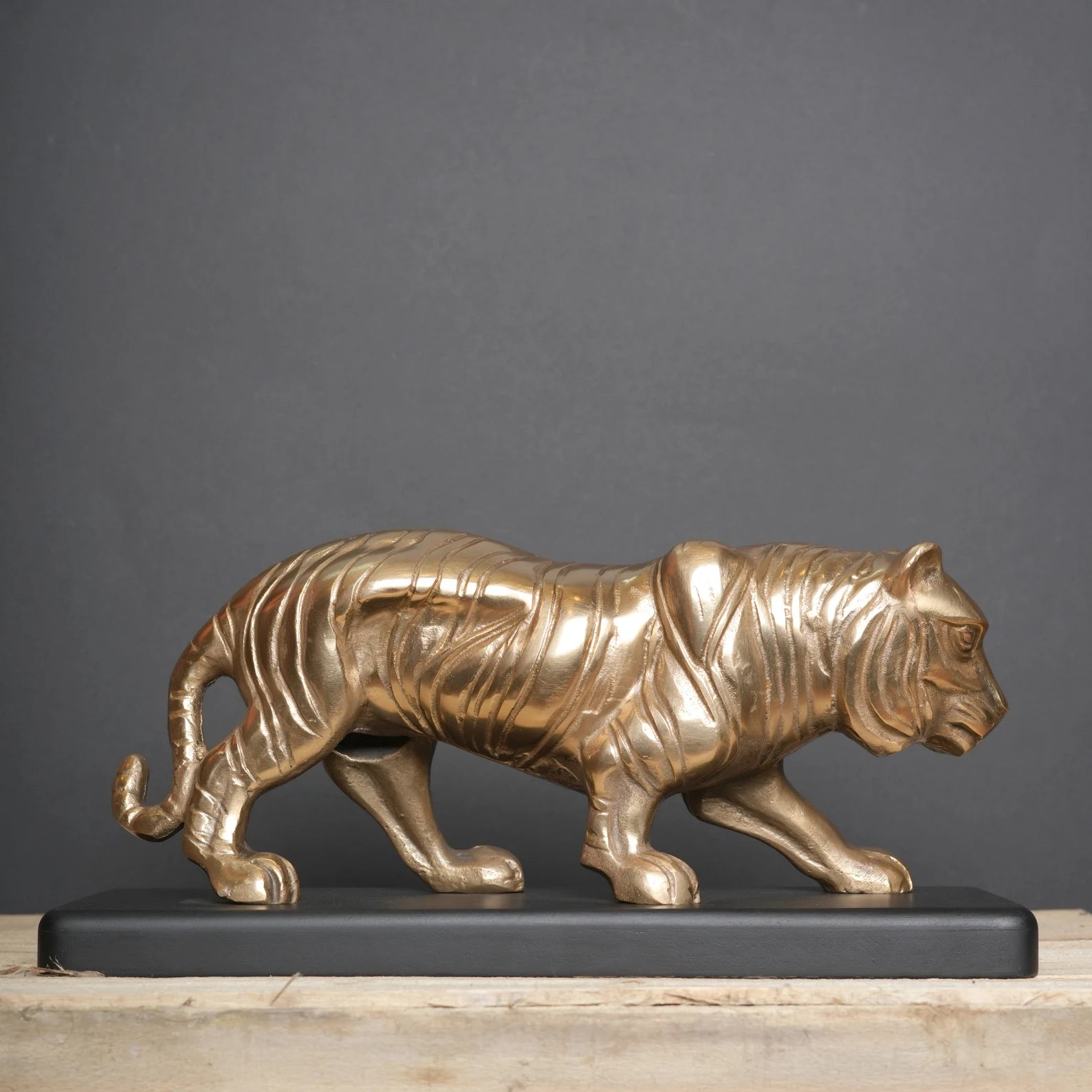 Majestic Tiger Sculpture on Black Wooden Base